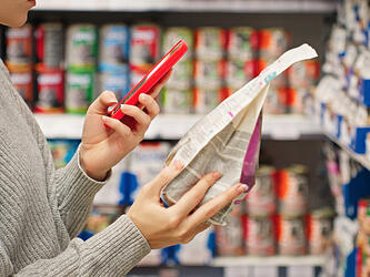 Person checking package in a shop